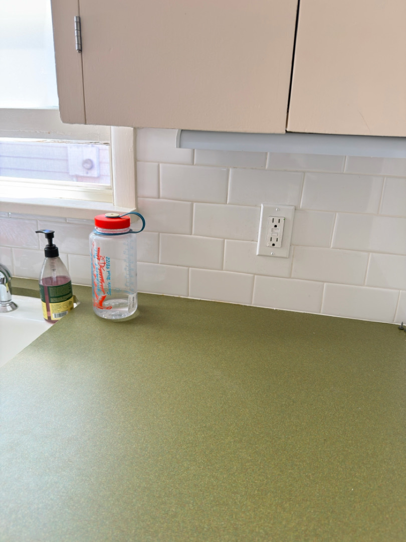 Kitchen backsplash with GFCI outlet installed above countertop for dishwasher and small appliances in Portland