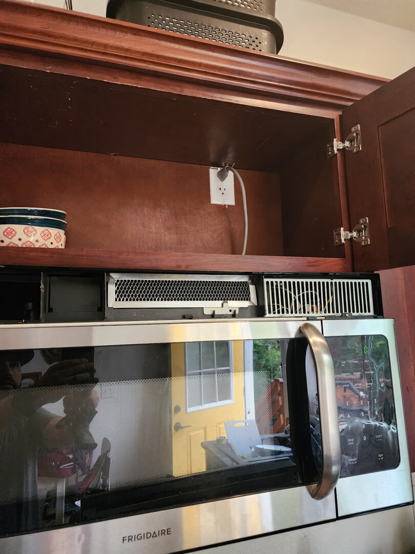 Microwave installed in kitchen cabinet powered by dedicated 20-amp circuit in Portland OR