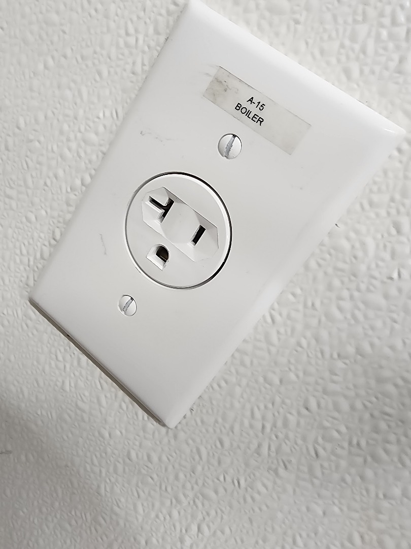 Newly installed 20-amp commercial outlet with horizontal slot configuration on wall in Portland OR