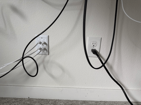Closet outlet in use with devices plugged in showing functional power access in Portland OR