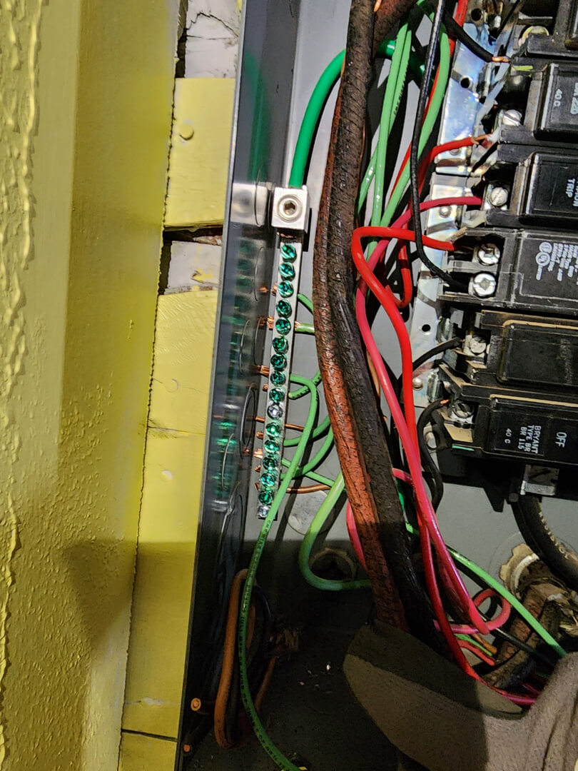 Electrical panel interior with breakers and wiring for 200 amp meter main combo installation in Portland OR