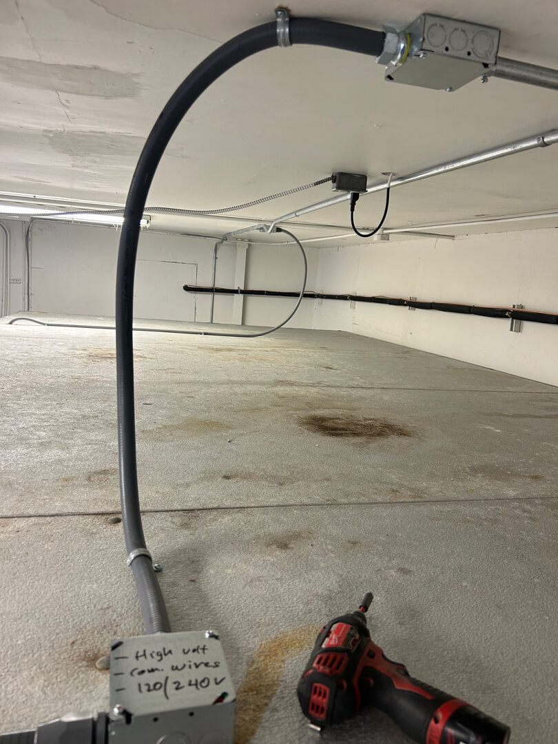 Flexible conduit and junction box installed for walk-in freezer electrical connection in commercial space Portland OR