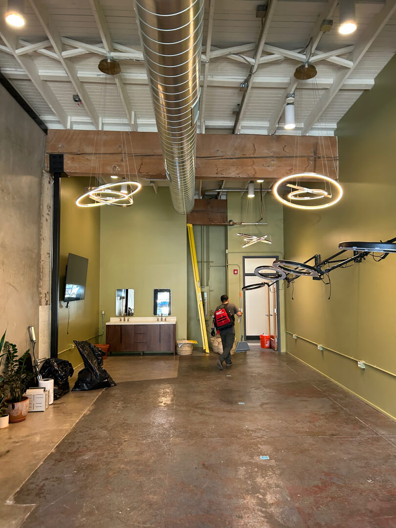Commercial space with newly installed overhead lighting fixtures improving brightness and visibility in Portland OR