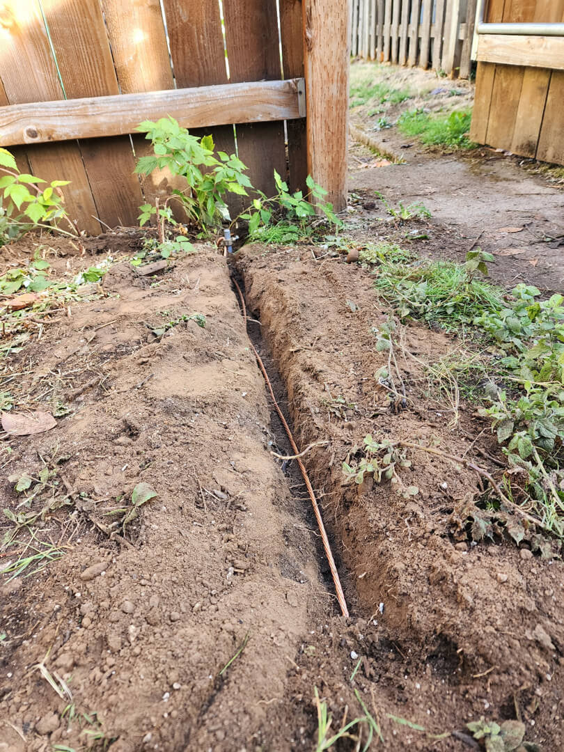 Trench dug for underground electrical conduit installation for 200 amp service upgrade in Portland OR