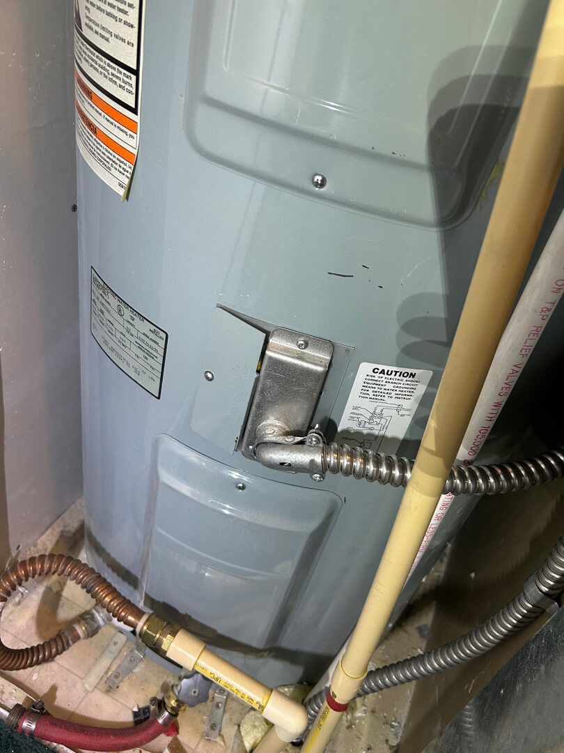 Electric water heater with connected conduit and wiring after circuit extension installation in Mulino OR