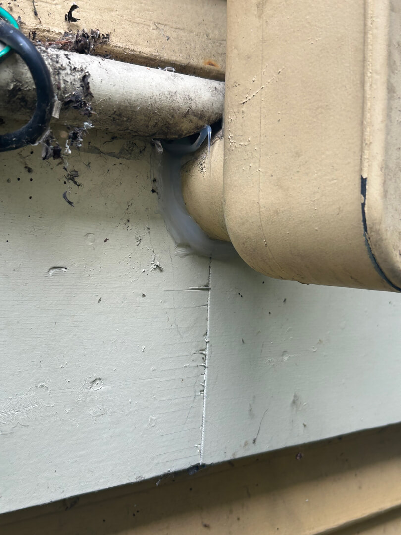 Damaged or corroded electrical conduit connection at exterior wall requiring repair in Portland OR