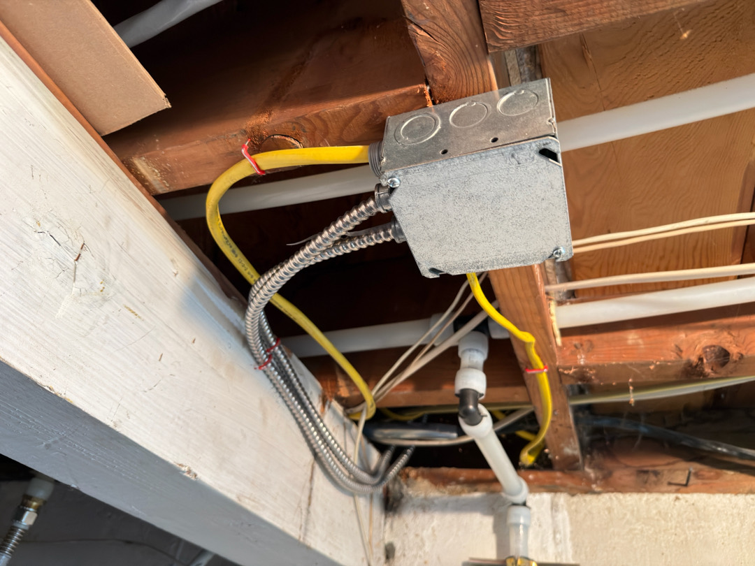 Electrical junction box with wiring connections for dishwasher circuit installation under floor framing in Portland OR