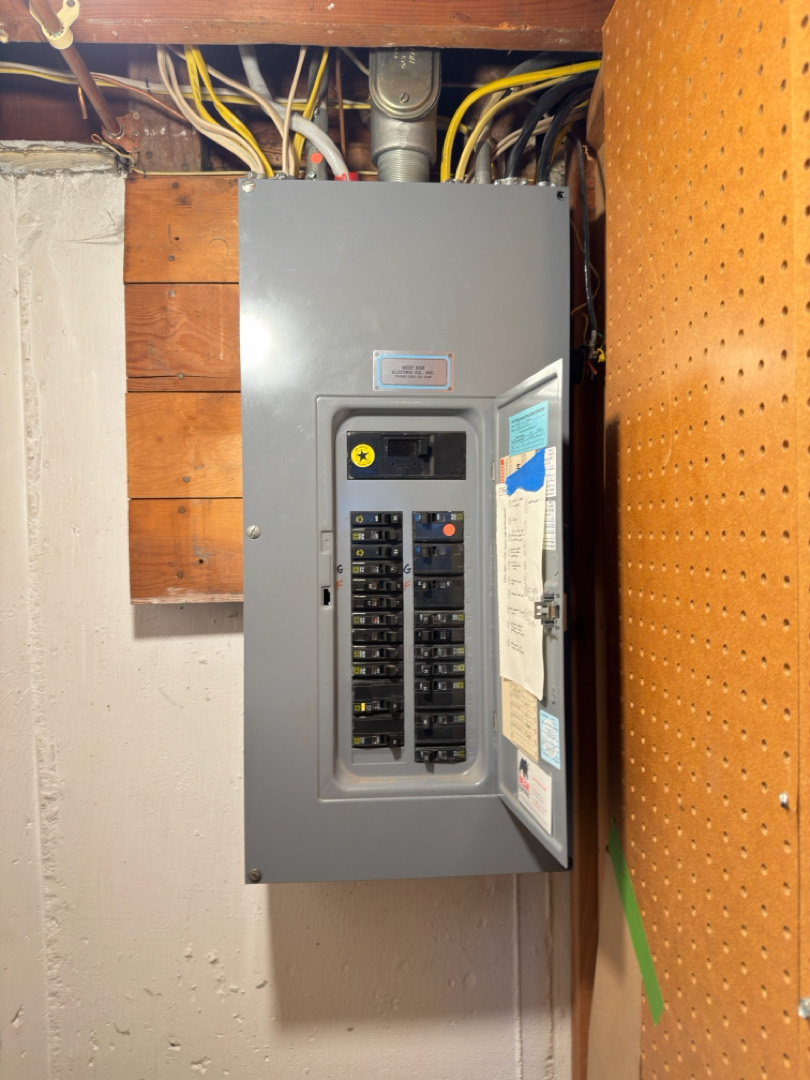 Electrical panel with labeled breakers and wiring for dishwasher circuit and GFCI reconfiguration in Portland