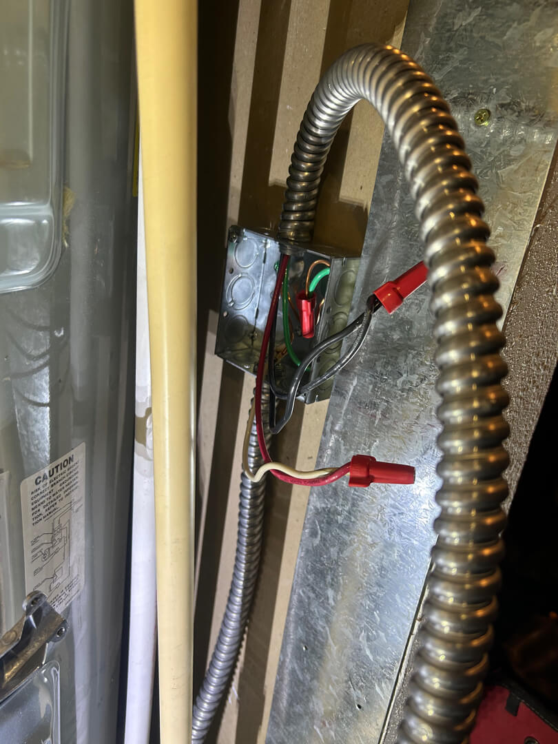 Flexible metal conduit and electrical wiring connected for water heater circuit extension in Mulino OR