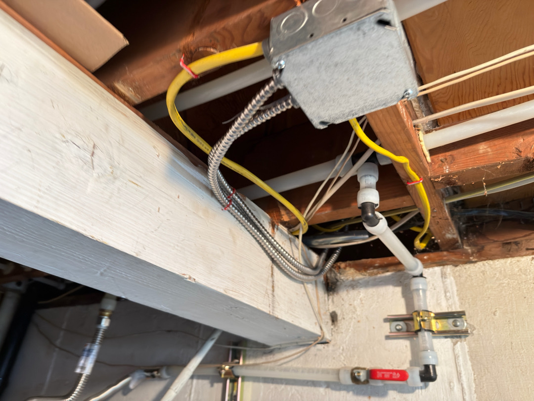 Electrical junction box with wiring connections for dishwasher circuit installation under floor framing in Portland OR