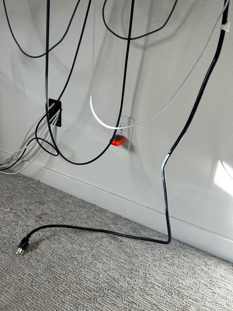 New electrical outlet installed inside closet with wiring routed neatly along baseboard in Portland OR