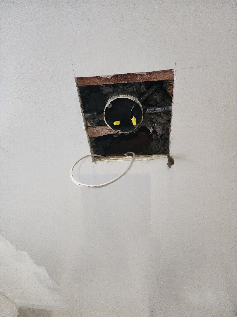 Ceiling electrical box with updated wiring connections during lighting installation in Portland OR