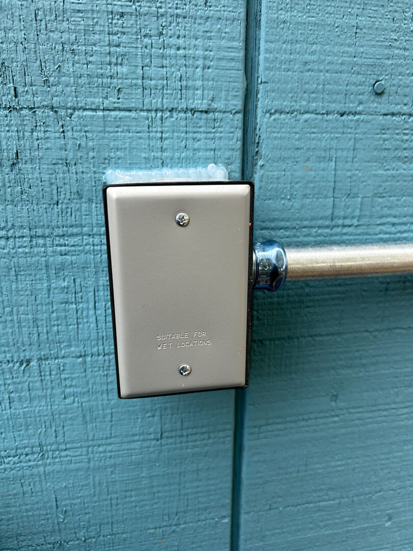 Weatherproof electrical junction box connected to exterior conduit for 20-amp circuit in Beaverton OR