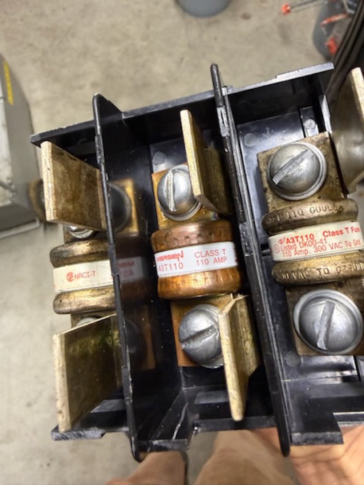 Fuse block holding the 125-amp cartridge fuses replaced on the Beaverton service call