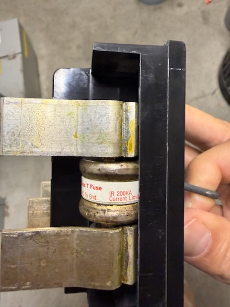 Close-up of a cartridge fuse seated in the fuse block