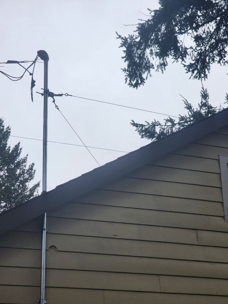Service mast with weatherhead and guy wire support installed, Portland, OR